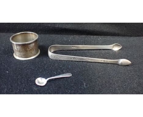 A PAIR OF BRIGHT CUT SILVER SUGAR TONGS with a napkin ring and mustard spoon