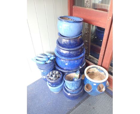 A COLLECTION OF DARK BLUE GARDEN POTS  12 pots in a variety of sizes and a strawberry planter and other similar items