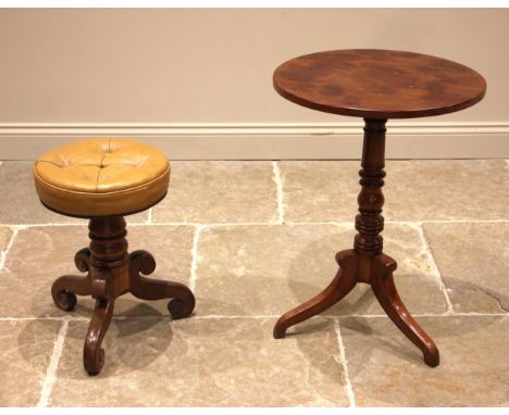 A 19th century mahogany tripod table, the circular top upon a cup and baluster turned pedestal, extending to three down swept