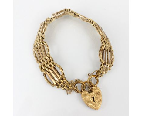 A 9ct yellow gold gate link bracelet, the stylised gate link bracelet suspending a heart shaped fastener, stamped to reverse,