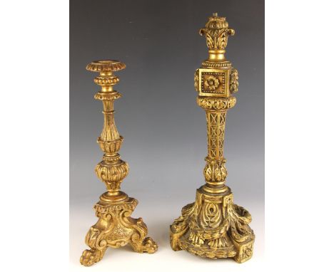 A giltwood Italianate pricket candlestick, 19th century, the floral sconce raised on an inverse tapering column decorated wit