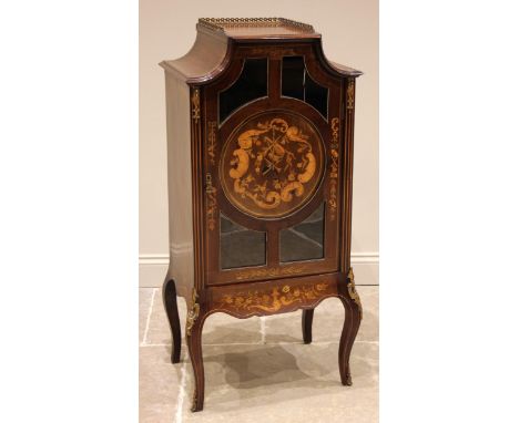 A French Louis XV style inlaid mahogany display cabinet, late 19th century, the pagoda shaped top with a three quarter brass 
