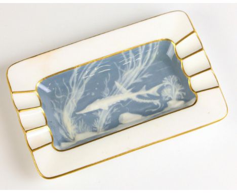 A Mintons pate sur pate pin tray or trinket dish, 20th century, the well decorated with sturgeons swimming amongst seaweed, p
