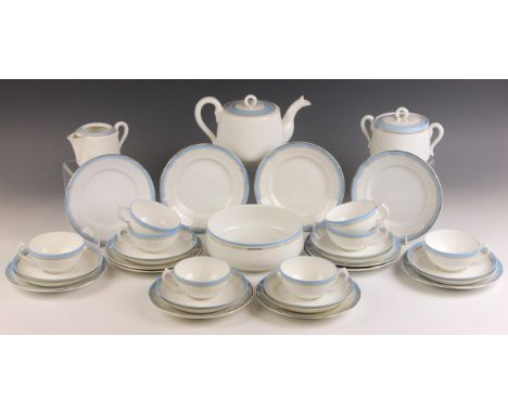 A Russian porcelain tea service by Kuznetsov Factory, early 20th century, comprising; eight teacups, seventeen saucers, twelv