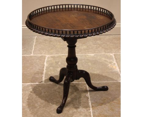 A mahogany Chippendale revival silver table, 19th century, possibly Irish, the circular top with a gadrooned rim and baluster