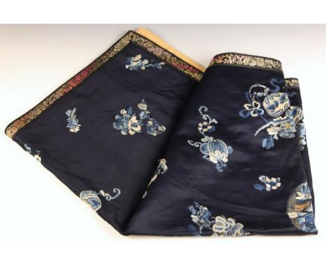 A Chinese silk embroidered panel, 19th century, the rectangular panel with a deep blue ground both long stitch embroidered an