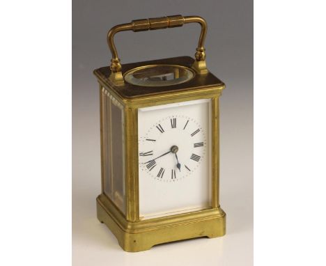 A brass cased French carriage timepiece, early 20th century, the 5cm white enamelled dial applied with Roman numerals and enc