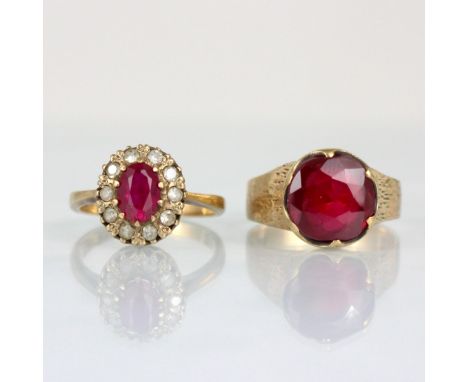 A 9ct synthetic ruby ring, the round cut red stone within claw setting edge, leading to engraved shoulders and plain polished