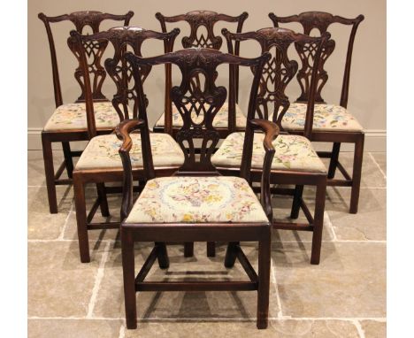 A set of six Chippendale revival mahogany dining chairs, late 19th century, each with an interlaced openwork splat back appli
