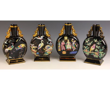 A pair of Victorian Jetware moon flasks, each of typical form and decorated in polychrome enamel with cranes, birds, fish, an