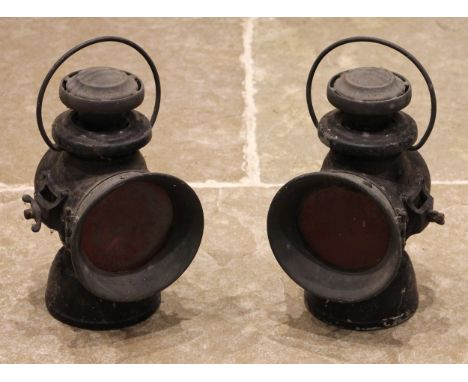 A pair of vintage Lucas Ltd 'King of the road' oil powered motoring lamps, finished in black, 34cm high (2) (at fault)