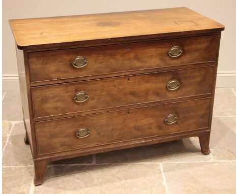 An early 19th century mahogany chest of drawers, the rectangular top with rounded front corners over an arrangement of three 