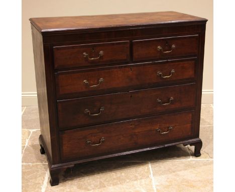 A George III oak and mahogany crossbanded chest of drawers, formed with two over three lip moulded and oak lined, graduated l