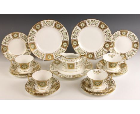 A Royal Crown Derby part tea service in the ‘Green Derby Panel’ pattern, comprising: four teacups (one at fault), four saucer