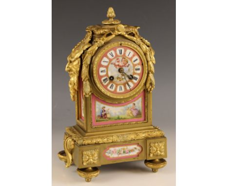 A 19th century French ormolu and pink porcelain inset 8 day mantel clock, movement by Japy Freres, the circular dial (at faul