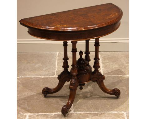 A Victorian figured walnut fold-over card table, the demi lune moulded and book veneered top inlaid with boxwood stringing an