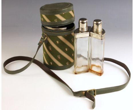 An early 20th century silver-plated three-piece hunting stirrup cup, the three silver plate mounted decanters of triangular s