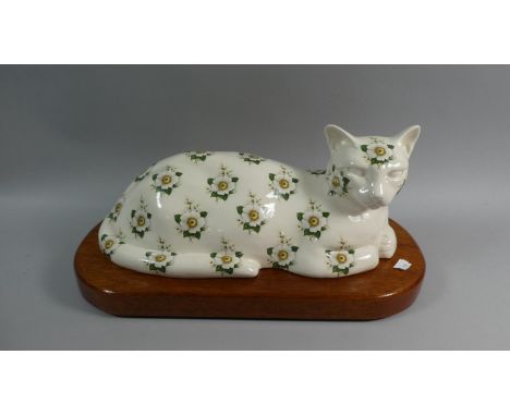 A Limited Edition Ceramic Study of a Reclining Cat, Harvey no.89/150 Signed P A Bootle On Wooden Plinth, 42cm Wide 