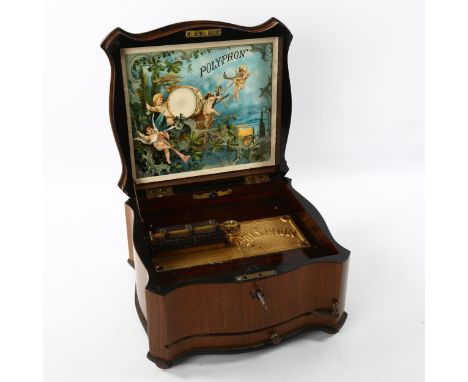 A 19th century polyphon in serpentine-shaped walnut case, original printed label inside lid, Retailer's Douglas &amp; Co of S