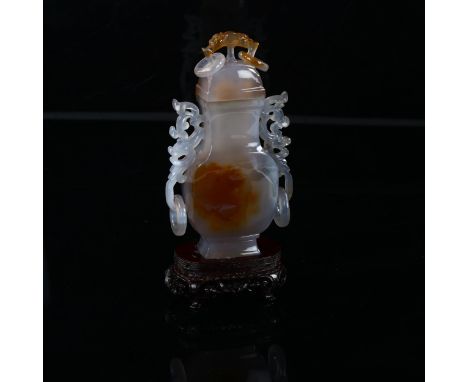 A Chinese jade/agate square-section vase and cover, carved from a single piece of hardstone, with integral pierced and scroll