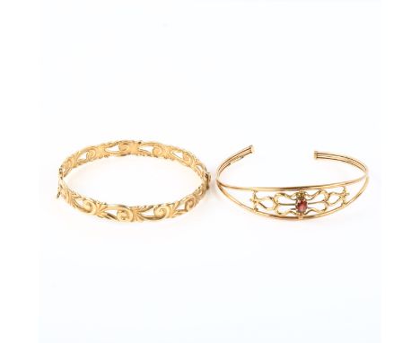 A 9ct gold garnet set cuff bangle, and a 9ct gold hinged acanthus scroll design bangle (2), 14.6g total - BBC Antiques Road T