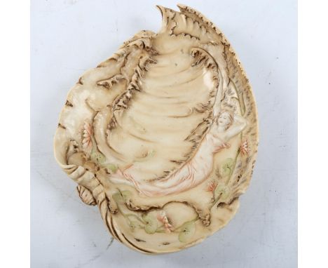 An Art Nouveau relief moulded ceramic dish, probably by Royal Dux, with design of a figure and waterlilies, impress marks 324