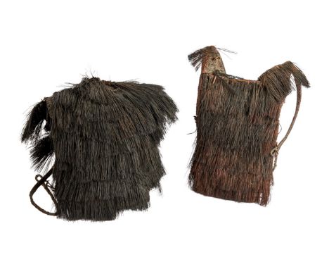 A pair of woven ceremonial ethnographic chest plates belonging to Dennis Hopper. Both feature two straps and an interior comp