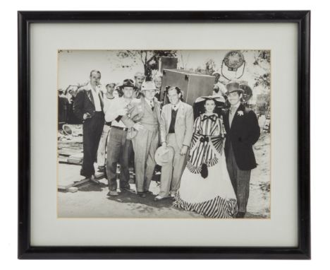 A vintage photograph (printed later) taken by Fred Parrish of Vivien Leigh, Clark Gable, and various unidentified crew member