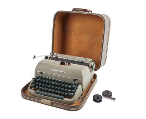 A vintage portable Remington Quiet-Riter typewriter owned and used by Dennis Hopper.Includes two reels for ribbon (one empty 