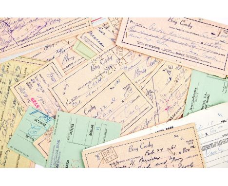 A collection of approximately 35 checks signed by Bing Crosby in blue or black ink, dated 1961.Crosby was one of the more ico