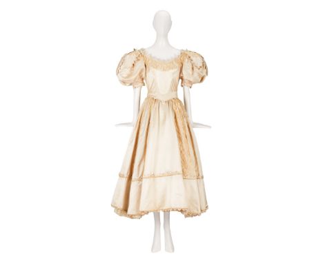 A champagne-colored duchess satin wedding gown designed for Judy Garland as Manuela in the film production The Pirate, co-sta