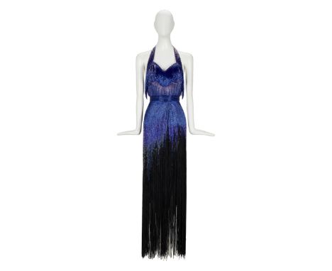 An embellished form-fitting gown with an ultra-high slit that has all the razzle and dazzle to match Grable's performance as 