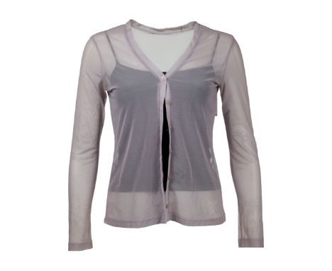 A pair of tops as seen worn by Emily Bergl as "Rachel Lang" in the thriller The Rage: Carrie 2 (United Artists, 1999).The top