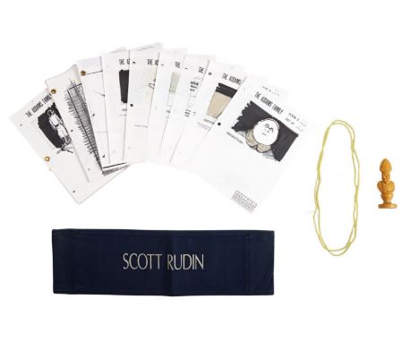 Original props including an unfinished chess piece, a faux pearl necklace, a chairback belonging to Scott Rudins, and storybo