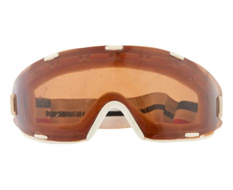 A pair of Killy ski goggles that belonged to Dennis Hopper. The front features a brown-tinted plastic lens and an adjustable 