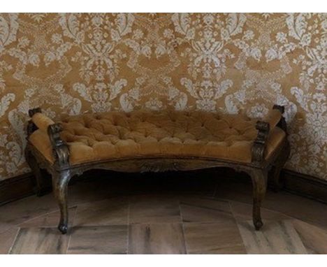 A Louis XV style curved walnut bench with button tufted upholstery in apricot velvet fabric. From the foyer at Woodland.24 1/
