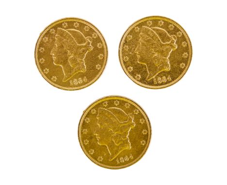 A group of three gold-tone coin props as seen used in Sahara (Paramount Pictures, 2005).The coins are composed of a metal all