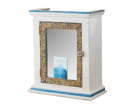 A white cabinet with mirror door from the Mabel Dodge Luhan house Dennis Hopper occupied in Taos, New Mexico. The white cabin