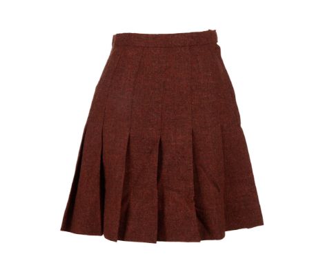 A cheer-style mini skirt as seen worn by Natasha Lyonne as "Megan Bloomfield" in the comedy/drama But I'm a Cheerleader (Chee