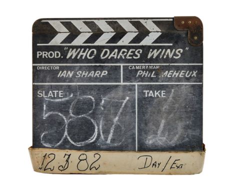 An original clapperboard used on the set of Who Dares Wins (Richmond Light Horse Productions, 1982), starring Lewis Collins. 