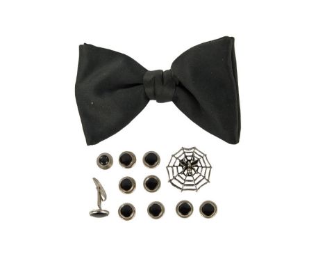 A black tuxedo bowtie, personally owned and worn by Dennis Hopper. Together with five pairs of cufflinks and a spiderweb&nbsp