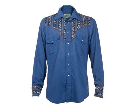 A pair of vintage patterned button-down shirts, personally-owned by Dennis Hopper. This lot includes an Aegean blue, western-