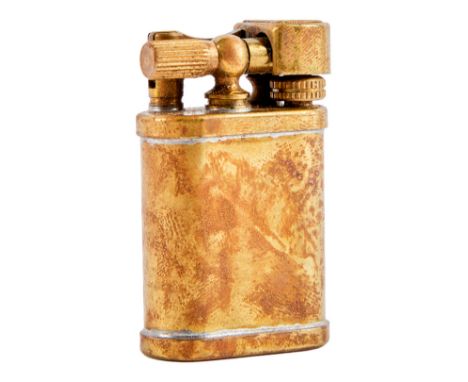 A brass tone lighter as seen used by Sean Penn as Glendon Wasey in Shanghai Surprise (HandMade Films, 1986). The film starred