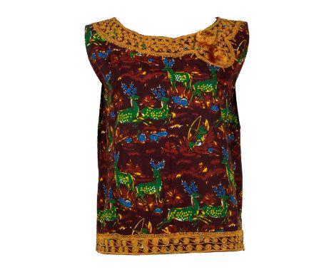 An 1960s sleeveless top belonging to Elizabeth Taylor with a novelty print of green deer, blue flowers, and brown base color.
