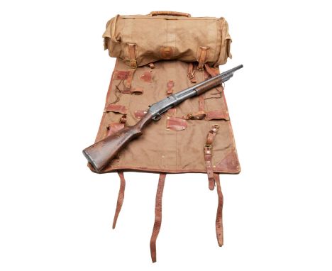 An original pull-apart Winchester Model 1897 shotgun prop and canvas fold-out ammunitions bag as seen used by Brendan Fraser 