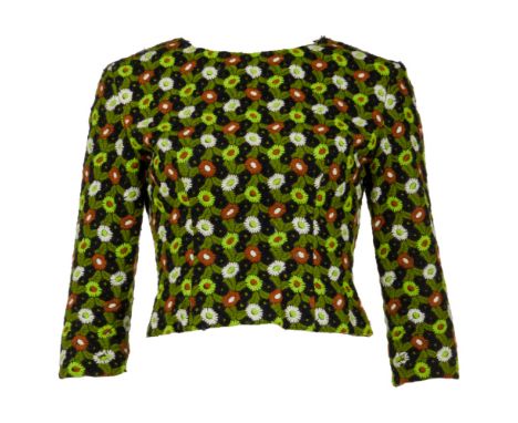A 1960s tailored bodice with all floral embroidery in autumnal tones, owned by Elizabeth Taylor. The demi-couture bodice has 