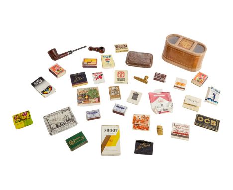 A group of smoking accessories personally owned by Dennis Hopper, including: rolling papers;&nbsp;pipes; matchbooks and boxes