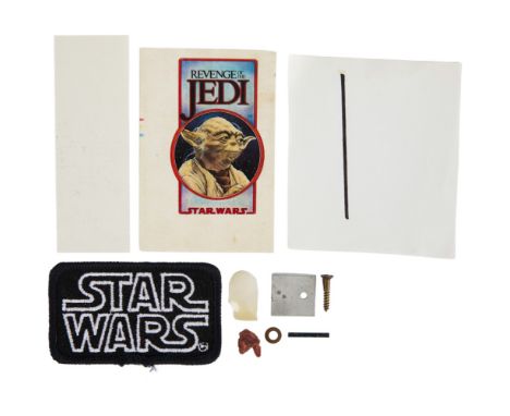 A group of original six original Yoda animatronic component parts, a hand-drawn rotoscope lightsaber animation, a section of 