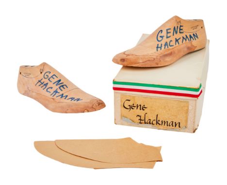 A pair of shoe molds custom made for Gene Hackman by Pasquale di Fabrizio, together with paper cut out designs used to make t
