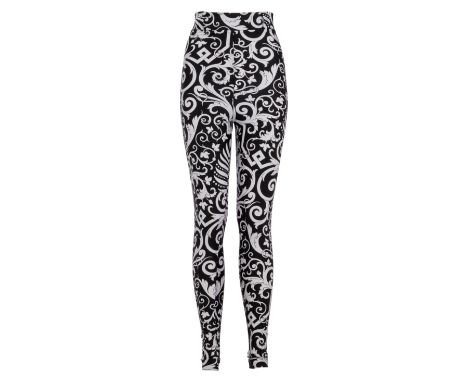 A pair of figure hugging black and white leggings with an ornate print, owned by Elizabeth Taylor. &nbsp;The leggings are lab